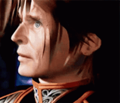 A Close Up Of A Man 'S Face With A Red Collar GIF