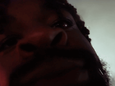A Close Up Of A Man 'S Face With A Red Eye GIF
