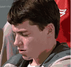 A Close Up Of A Man 'S Face With A Red Shirt In The Background GIF