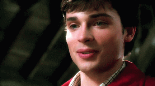 A Close Up Of A Man 'S Face With A Red Shirt GIF