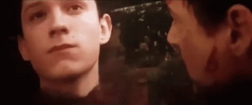 A Close Up Of A Man 'S Face With A Reflection Of Another Man . GIF