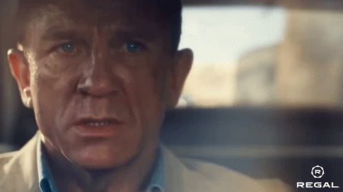 A Close Up Of A Man 'S Face With A Regal Logo On The Bottom Right GIF