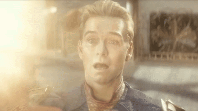 A Close Up Of A Man 'S Face With A Scarf Around His Neck And A Surprised Look On His Face . GIF