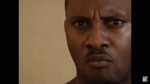 A Close Up Of A Man 'S Face With A Serious Expression . GIF