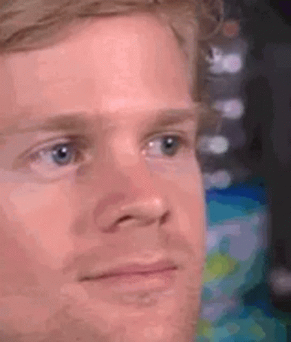 A Close Up Of A Man 'S Face With A Serious Expression . GIF