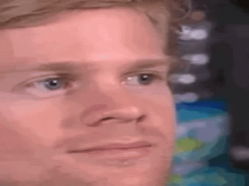 A Close Up Of A Man 'S Face With A Serious Expression . GIF