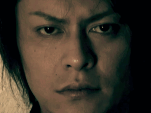 A Close Up Of A Man 'S Face With A Serious Expression GIF