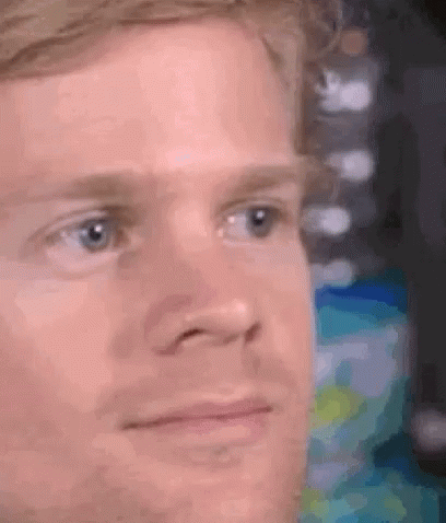 A Close Up Of A Man 'S Face With A Serious Expression On His Face . GIF