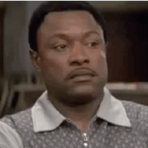 A Close Up Of A Man 'S Face With A Serious Expression . GIF