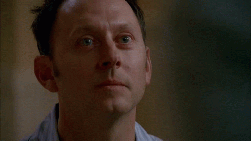 A Close Up Of A Man 'S Face With A Serious Expression GIF