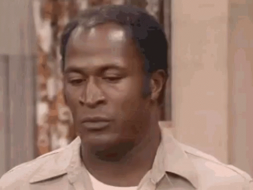 A Close Up Of A Man 'S Face With A Serious Expression . GIF