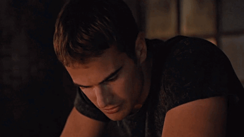 A Close Up Of A Man 'S Face With A Serious Look On His Face GIF