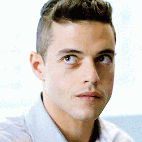 A Close Up Of A Man 'S Face With A Serious Look On His Face . GIF