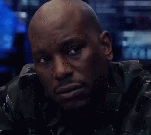 A Close Up Of A Man 'S Face With A Serious Look On His Face GIF