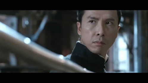 A Close Up Of A Man 'S Face With A Serious Look On His Face GIF