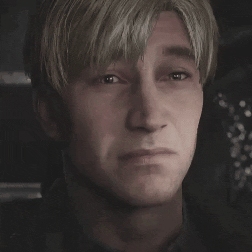 a close up of a man 's face with a serious look on his face