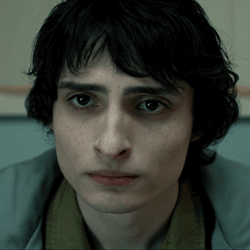 A Close Up Of A Man 'S Face With A Serious Look On His Face GIF