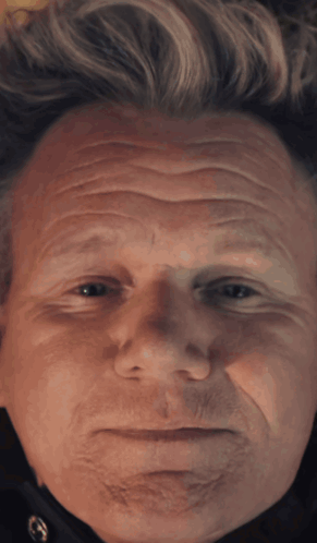 A Close Up Of A Man 'S Face With A Serious Look GIF