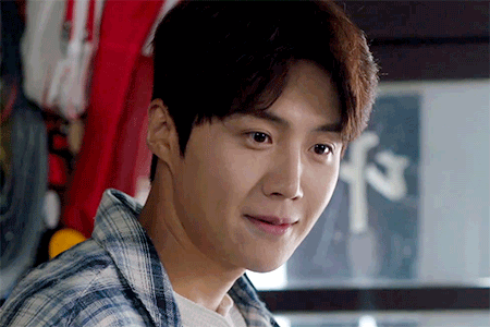 A Close Up Of A Man 'S Face With A Sign In The Background That Says F3 GIF