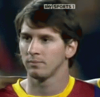 A Close Up Of A Man 'S Face With A Sky Sports 1 Advertisement Behind Him GIF