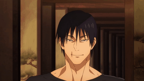 A Close Up Of A Man 'S Face With A Slight Smile On His Face GIF