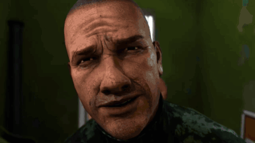A Close Up Of A Man 'S Face With A Slight Smirk On It GIF