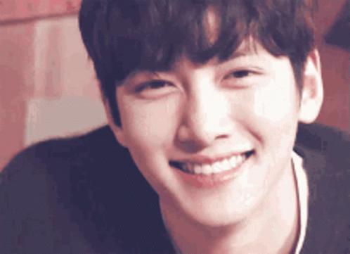 A Close Up Of A Man 'S Face With A Smile On His Face GIF