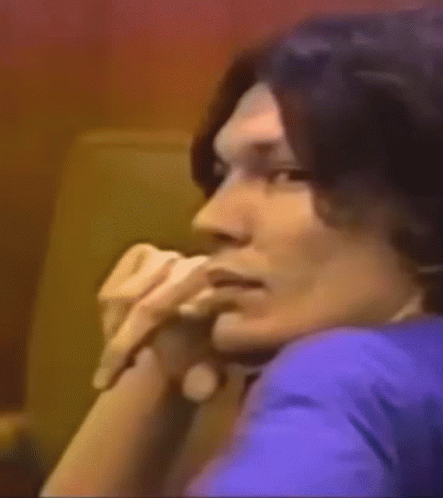 A Close Up Of A Man 'S Face With A Smile On His Face . GIF