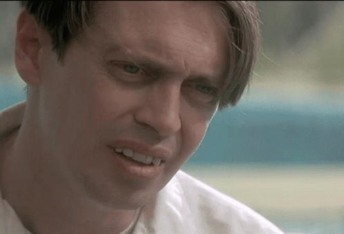 A Close Up Of A Man 'S Face With A Smile On His Face GIF