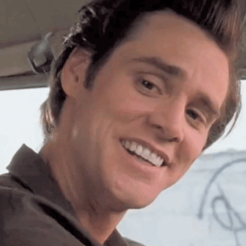 A Close Up Of A Man 'S Face With A Smile On It GIF