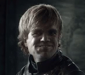 A Close Up Of A Man 'S Face With A Smile On It . GIF