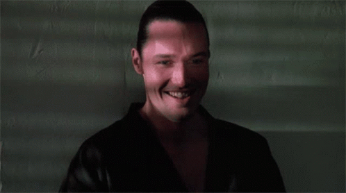 A Close Up Of A Man 'S Face With A Smile On It GIF