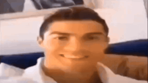 A Close Up Of A Man 'S Face With A Smile On It . GIF