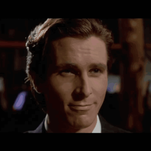 A Close Up Of A Man 'S Face With A Smile On It GIF