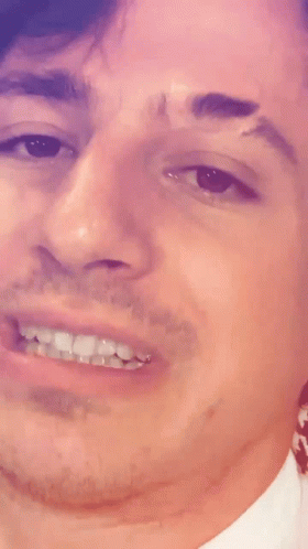 A Close Up Of A Man 'S Face With A Smile GIF