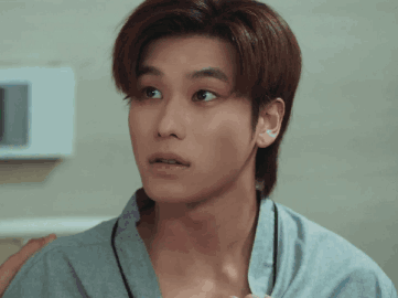 A Close Up Of A Man 'S Face With A Surprised Expression GIF