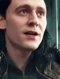 A Close Up Of A Man 'S Face With A Surprised Expression On His Face . GIF