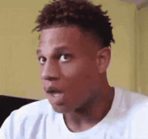 A Close Up Of A Man 'S Face With A Surprised Look On His Face GIF
