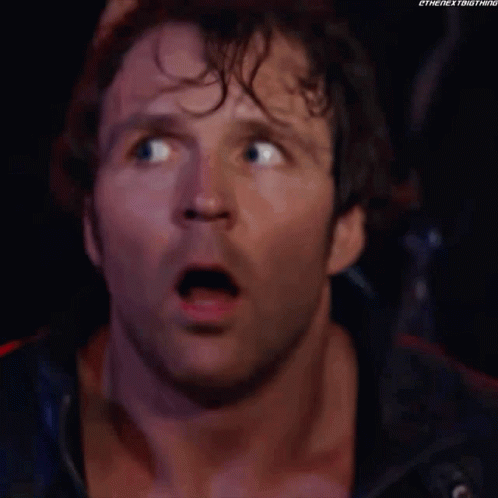 A Close Up Of A Man 'S Face With A Surprised Look On His Face And His Mouth Open . GIF