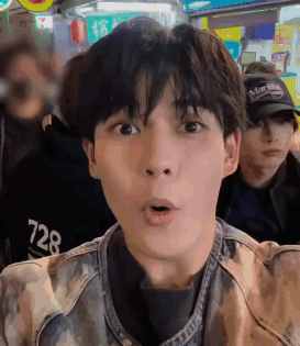 A Close Up Of A Man 'S Face With A Surprised Look On His Face GIF