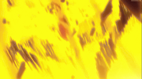 A Close Up Of A Man 'S Face With A Sword In His Hand GIF