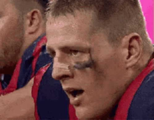 A Close Up Of A Man 'S Face With A Tattoo On His Eyebrow . GIF