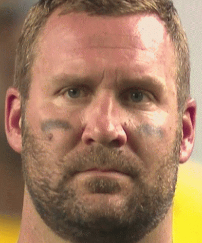 A Close Up Of A Man 'S Face With A Tattoo On His Forehead GIF