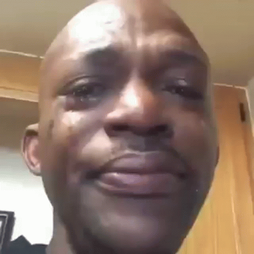A Close Up Of A Man 'S Face With A Tear Coming Out Of His Eye . GIF
