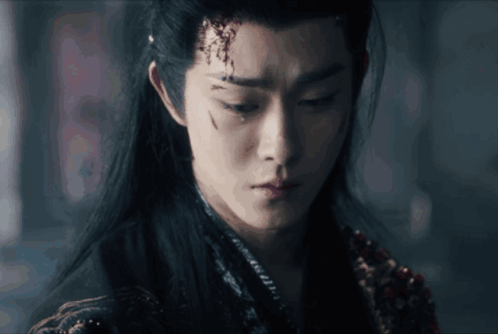 A Close Up Of A Man 'S Face With A Tear Coming Out Of His Eye GIF