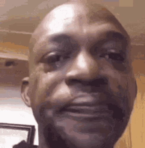 A Close Up Of A Man 'S Face With A Tear Coming Out Of His Eyes . GIF