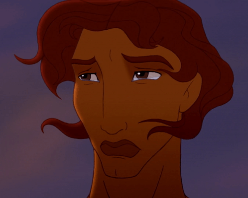 a close up of a man 's face with a tear running down his cheek