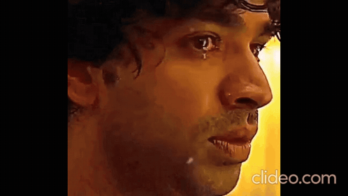 A Close Up Of A Man 'S Face With A Tear Running Down His Eye . GIF