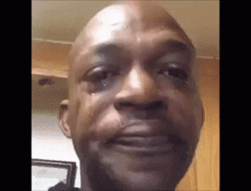 A Close Up Of A Man 'S Face With A Tear Running Down His Face . GIF