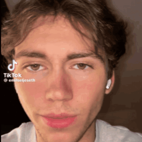 A Close Up Of A Man 'S Face With A Tiktok Watermark On It GIF